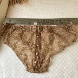 Sexy beige blush brief with six satin buttons up back.